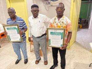 The Ashanti Regional Police Commander, COP. Mensah Duku, from left and Mr. Anthony Wularu with their Citations.