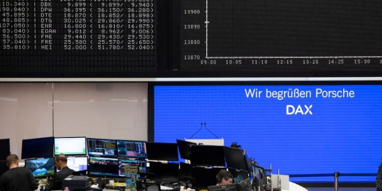 View of a display with the words "We welcome Porsche DAX" on the first day of its IPO. Photo: Hannes P Albert/dpa
