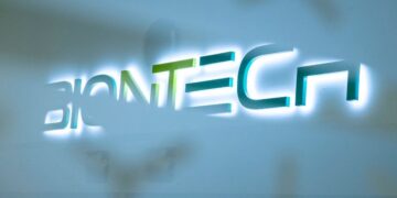 FILED - The Biontech company logo at the new production site in Marburg. Photo: Boris Roessler/dpa