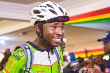 James Kumbeni poses for a picture after riding 170km from Bolga to Tamale to support Failatu's cook-a-thon attempt in January 2024. He will embark on a much longer journey from Bolga to Accra to support Joel Atinga break a Guinness World Record