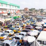 commercial transport cars in a market in Ghana