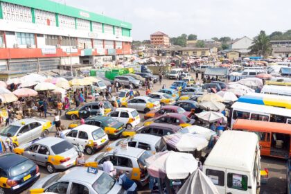 commercial transport cars in a market in Ghana