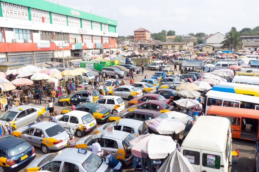 commercial transport cars in a market in Ghana