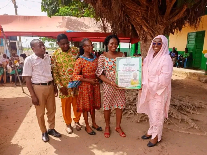 Dzifa Gomashie receives a citation after handing over the renovated Ansaru Islamic School to the community