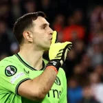 Emiliano Martinez shushes Lille fans during the Europa Conference League quarter-final match between Lille and Aston Villa