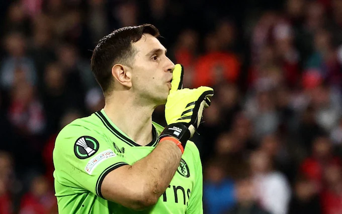 Emiliano Martinez shushes Lille fans during the Europa Conference League quarter-final match between Lille and Aston Villa