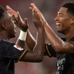 Vinicius Jr (left) greets Jude Bellingham