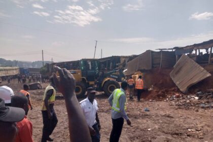 Traders watch as REGSEC demolish the Kwadaso Onion Market in the Ashanti Region