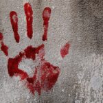 file photo showing a bloody fingerprint on a wall indicating murder