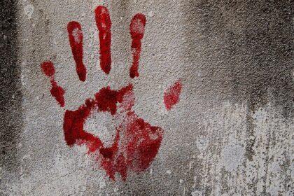 file photo showing a bloody fingerprint on a wall indicating murder