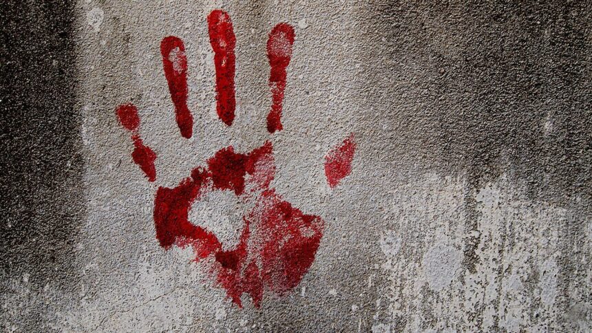 file photo showing a bloody fingerprint on a wall indicating murder