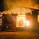 Stock photo of fire burning down a structure at the Shama Junction Market