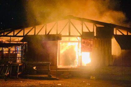 Stock photo of fire burning down a structure at the Shama Junction Market