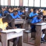 Students writing examinations