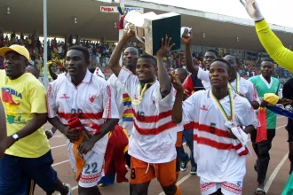 Ishmael Addo celebrates with Accra Hearts of Oak during their treble winning campaign in 2000