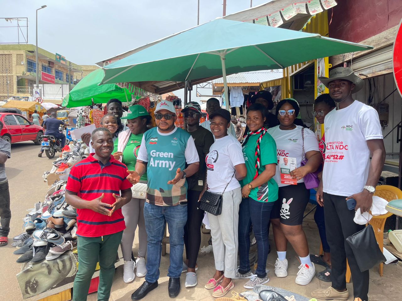 Mathias Johnson Alagbo, Volta Regional NDC Youth Organizer leads NDC Youth to tour Ho Market to interact with market women