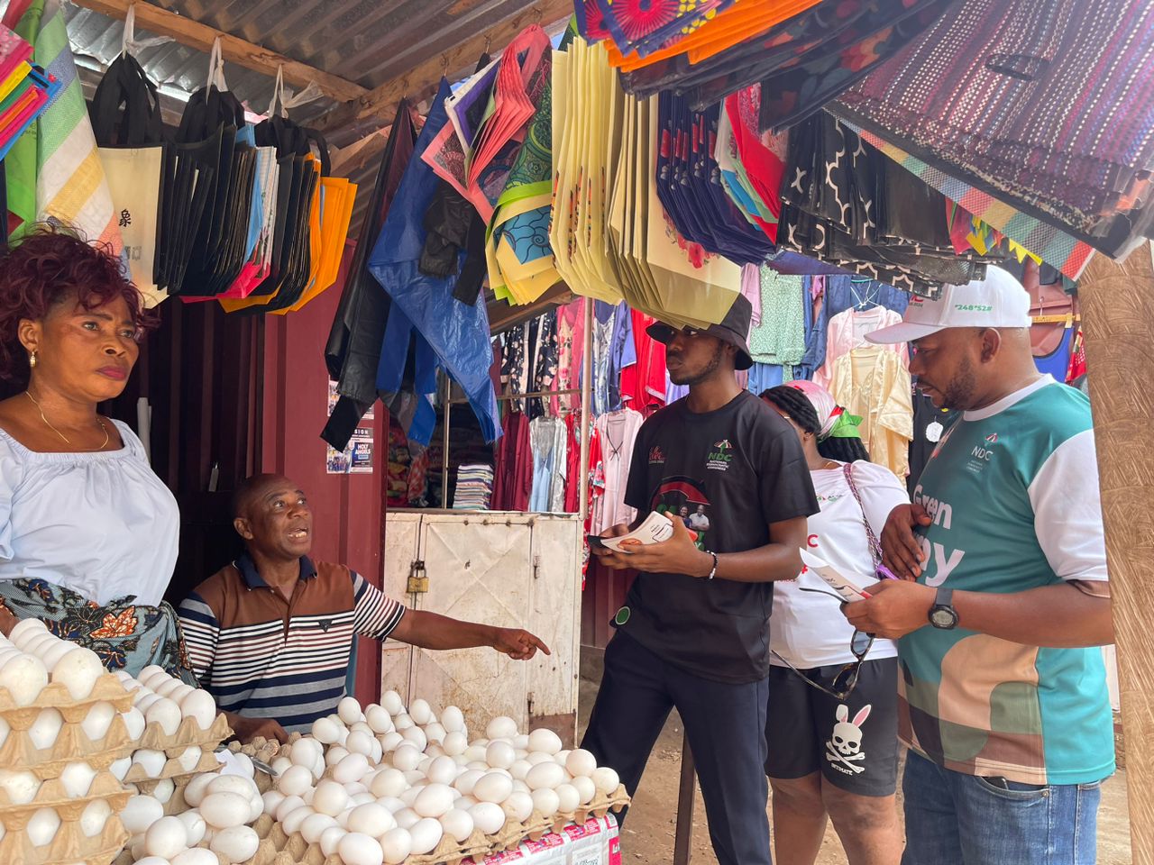 Mathias Johnson Alagbo, Volta Regional NDC Youth Organizer leads NDC Youth to tour Ho Market to interact with market women