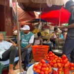 Mathias Johnson Alagbo, Volta Regional NDC Youth Organizer leads NDC Youth to tour Ho Market to interact with market women