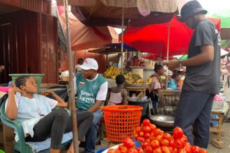Mathias Johnson Alagbo, Volta Regional NDC Youth Organizer leads NDC Youth to tour Ho Market to interact with market women