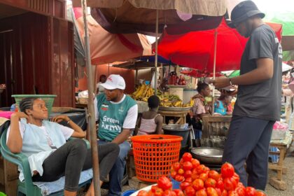 Mathias Johnson Alagbo, Volta Regional NDC Youth Organizer leads NDC Youth to tour Ho Market to interact with market women