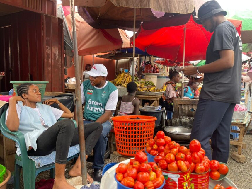 Mathias Johnson Alagbo, Volta Regional NDC Youth Organizer leads NDC Youth to tour Ho Market to interact with market women